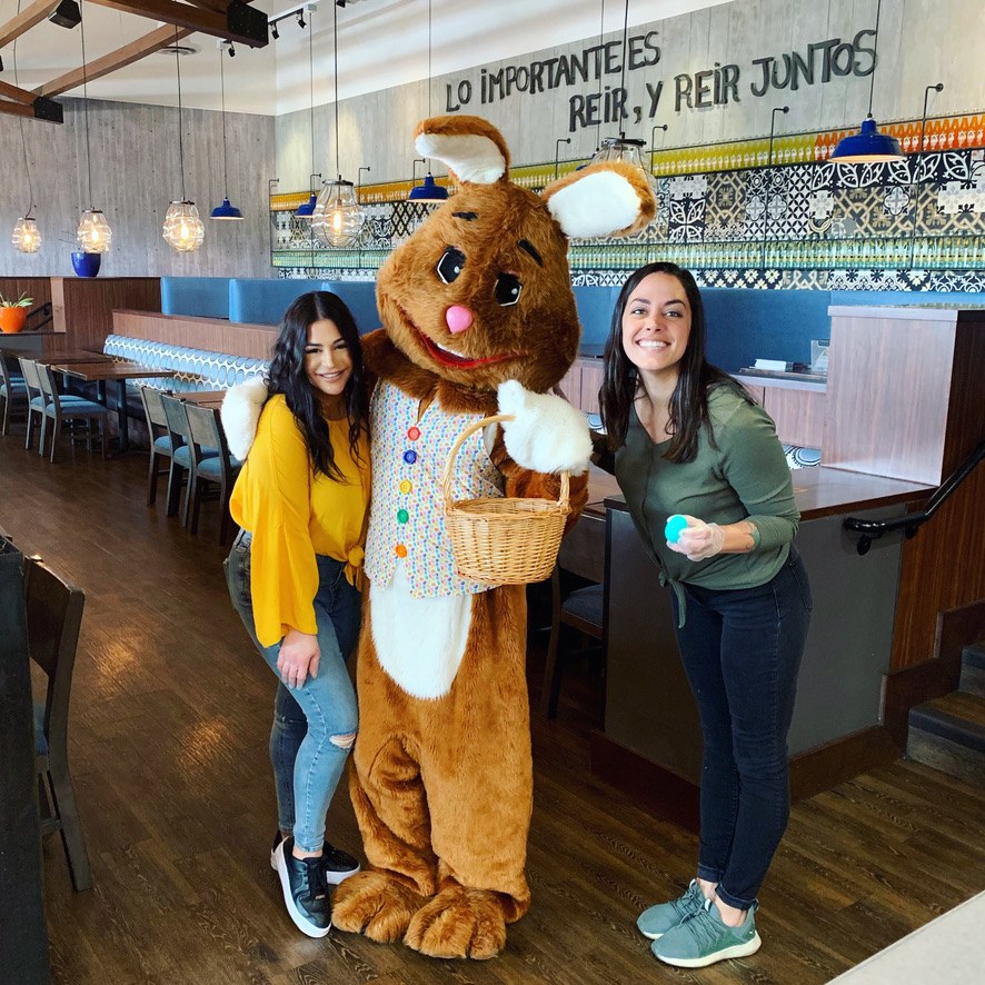Easter Bunny posing with guests indoors